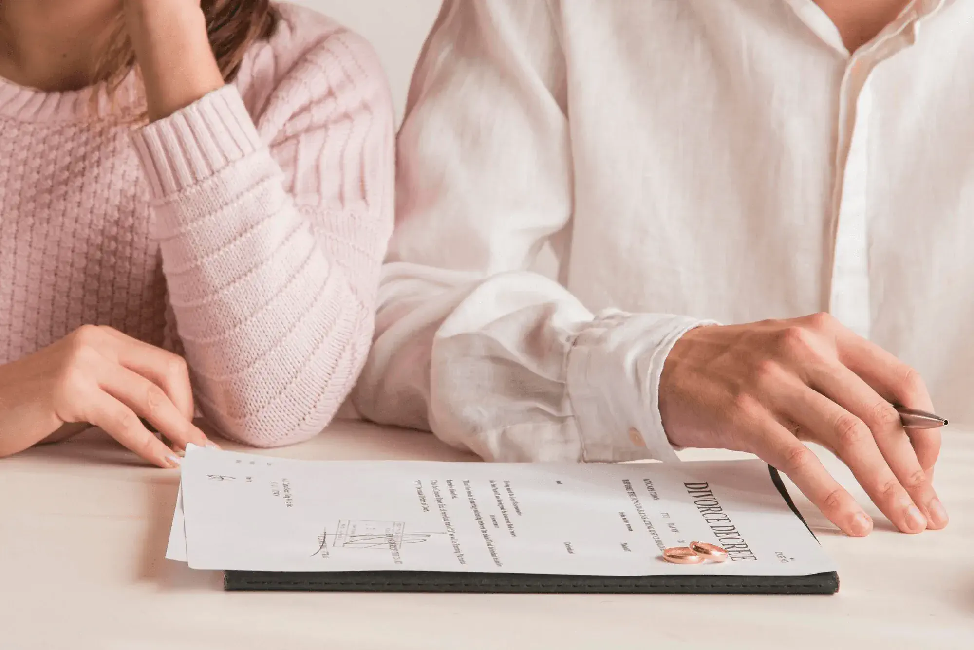 Spouses reviewing California divorce paperwork and financial documents